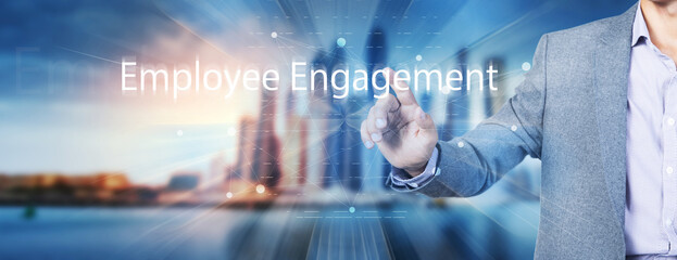 The concept of Employee Engagement. The man clicks on the screen.