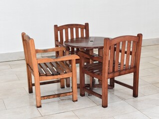 Round table and three chairs, on a white background