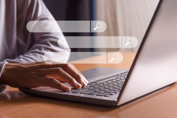 Internet search with search bar working with laptop computer in office, internet networking concept