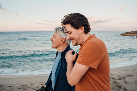Happy father and son spending time together on beach