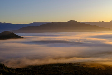 Langeberg mountainous landscape with fog at sunrise