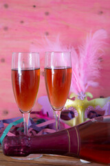 new year mask and glasses of champagne
