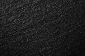 Black slate background. Coal background. Black, dark abstract stone texture.