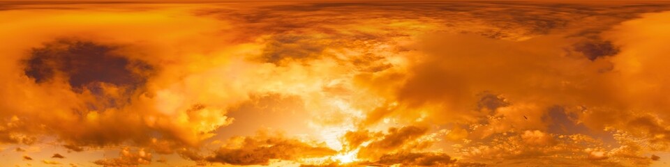 Golden glowing red orange overcast sunset sky panorama. Hdr seamless spherical equirectangular 360 panorama. Sky dome or zenith for 3D visualization and sky replacement for aerial drone 360 panoramas.