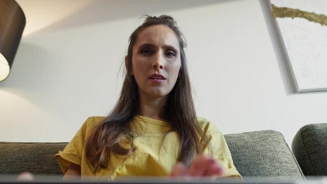 Laptop POV Of Caucasian Woman Typing On It And Being Focused. Shot With RED Helium Camera In 8K.  