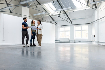Business people with colleagues standing in empty space