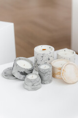 Set of stone Candle Holder with abstract smudges, cracks gray concrete with yellow flame. Use for planters, pot and decor interior. selective soft focus