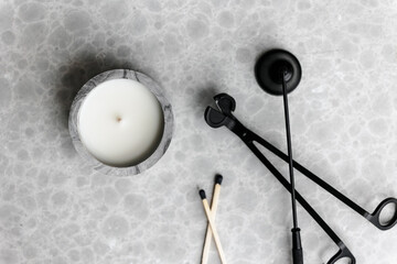 Handmade scented candles in concrete. long matches. Wick black metal scissors and bell for extinguishing candles. A modern fashionable and handy accessory for the home. 