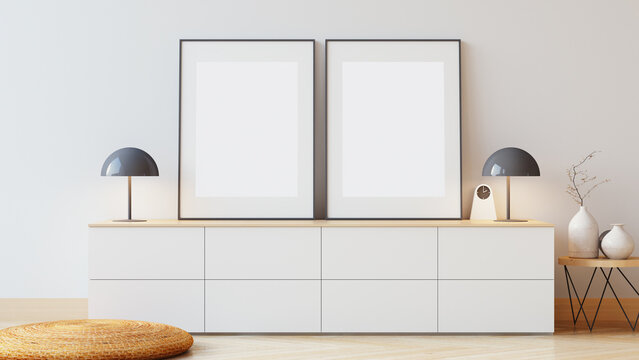 Blank picture frame on white wall. Luxury home interior 

design. Decorative items on the white cabinet - 3D render