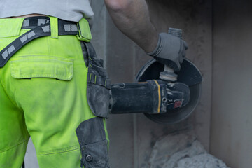 Cutting concrete wall with diamond blade.