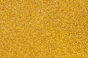 Golden glitter paper texture as background
