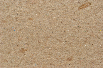 A sheet of brown recycled cardboard texture as background
