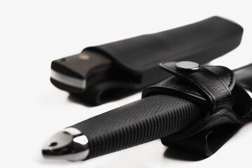 Hunting knife isolated on white background. souvenir collection dagger with a scabbard, with metal engraving, on a white background. Sharp knife blade, stainless steel knife.