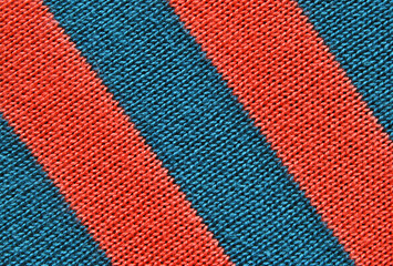 Blue and orange color striped jersey fabric texture as background