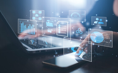 Businessman working on laptop and touch screen Online documentation database, IT consultant being...