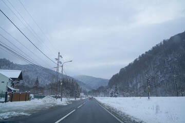 road. bridge over a valley in winter. the snow. low road traffic due to weather phenomena.