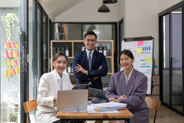 Portrait happy group of Asian business people meeting for start up project with colleagues look at camera and smile.