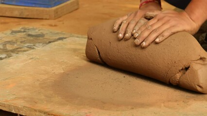 Potter at work makes ceramic dishes. India, Rajasthan.