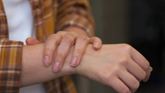 unrecognizable woman itches and moves her hands anxiously. an irritable woman. anxiety disorder symptoms concept