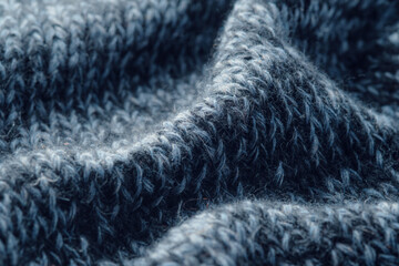 Texture knitted background. Folds of knitted woolen fabric close-up.
