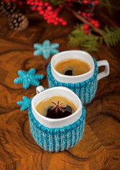 coffee with cardamom. winter drink. Coffee in cups with cardamom and white sugar on vintage wooden background
