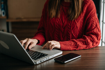 businesswoman hand using smart phone, tablet payments and holding credit card online shopping, omni channel, digital tablet docking keyboard computer at office in sun light.