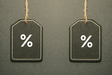percent sign on the black price tag, black mockup background