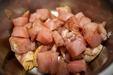 Raw pork pieces marinated in bowl