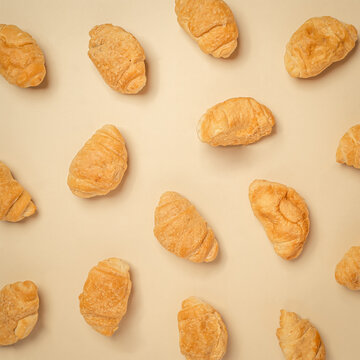 pattern of fresh bake gplden brown croissant for breakfast in bakery. minimal creative background composition.