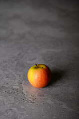 An apple on a gray background