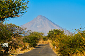 Colima volcano on a clear day with blue skies