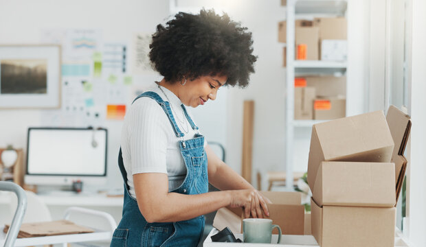 Startup, Delivery And Shipping In Boxes For Online Shopping Business. Businesswoman Packing Products From Online Business In A Box To Ship To Clients And Buyers. Black Woman Working In The Office