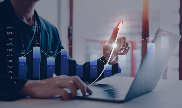 Analyst working with Business Analytics and Data Management System on graph make a report with KPI and metrics connected to database. Corporate strategy for finance, operations, sales, marketing