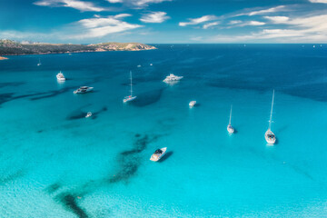 Aerial view of luxury yacht on blue sea in summer. Top view from drone. Beautiful seascape