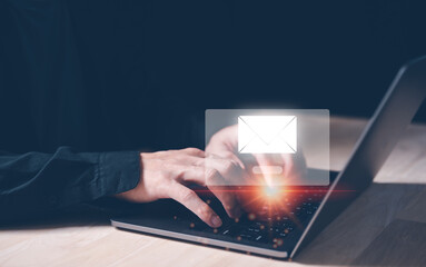 Businessman hand using Laptop pc with email icon, Email concept