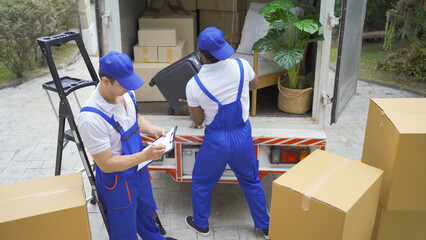 Team of employee workers with a truck car moving house for customers, delivering boxes with...