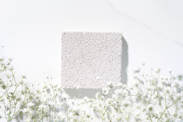 Summer minimal scene for beauty cosmetic product presentation made with white porous pumice stone...