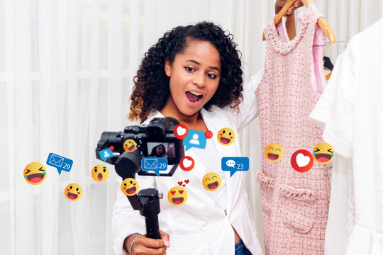 Portrait of african american fashion vlogger woman relax use digital technology social communication recording video content for live stream chat talk about with clothes with icon online social media