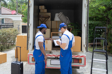 Team of employee workers with a truck car moving house for customers, delivering boxes with uniform.Vehicle transportation. Shipping and packaging business occupation service company. People lifestyle