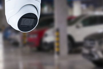 Fototapeta premium cctv camera installed on the parking lot to protection security.