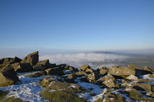 a view from the top of Clee hill on a foggy day where the fog has settled in the valley