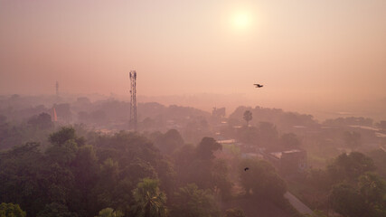 Fototapeta premium Aerial landscape view of a village in India, drone shot of Rural India during sunset or sunrise