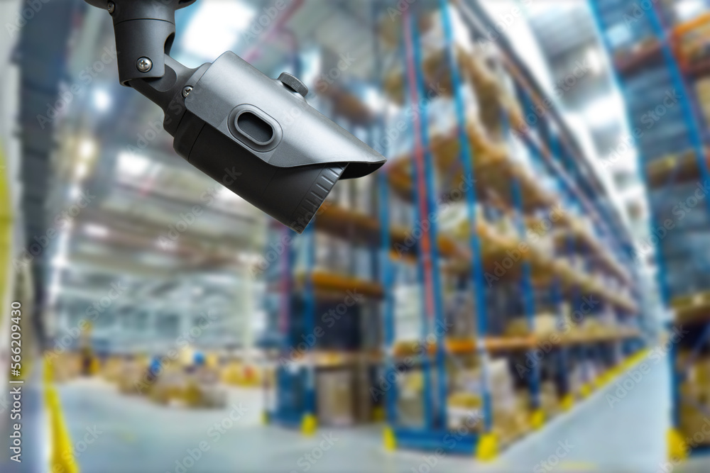Poster closed circuit camera multi-angle cctv system against the background of a modern warehouse complex. 