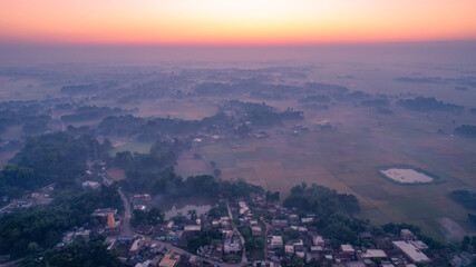 Aerial landscape view of a village in India, drone shot of Rural India during sunset or sunrise