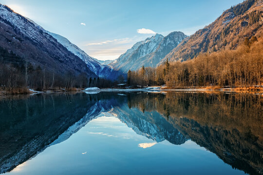 Mountain lake with water reflections at morning light. Salzburg country.