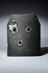 Bullet hole in composite body armour.