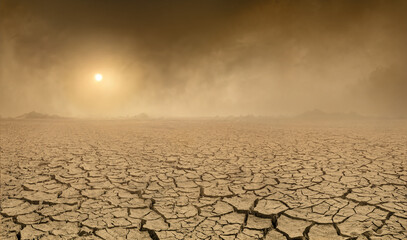 Panorama of arid barren land with cracked soil and sun barely visible through the approaching sand...