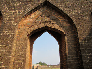 Arches on the stone walls of the ancient fort in Bidar.