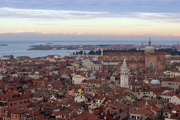 Fototapeta premium Venice city view from above. Golden hour photo. Beautiful Italian architecture in details. 