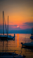 Fototapeta premium sunset, boat, sea, water, yacht, sky, sun, sailboat, sunrise, marina, boats, port, harbor, ocean, lake, sail, ship, bay, sailing, evening, harbour, calm, landscape, summer, reflection
